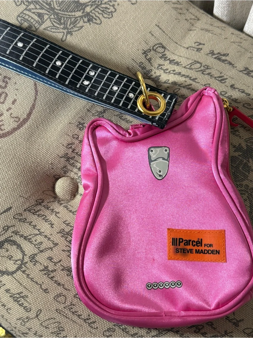 Parcel for Steve Madden pink guitar wristlet